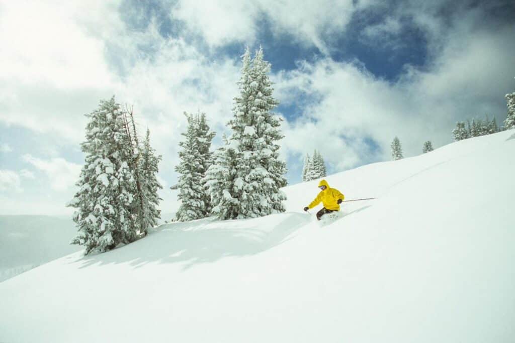 Skier in deep snow, Colorado high country conditions